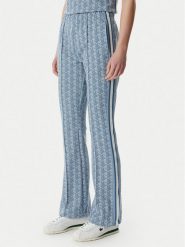 Lacoste Spodnie dresowe XF9313 Niebieski jasny Regular Fit. Niebieskie spodnie dresowe damskie Lacoste, bez wzorów, z bawełny. Za 739.99 zł.