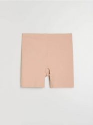 Szorty modelujące z silikonową taśmą na nogawkach - kremowy. Białe szorty damskie Sinsay, bez wzorów. Za 25.99 zł.