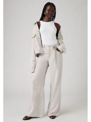 Levi's Spodnie - Comfort fit - w kolorze kremowym rozmiar: W30/L31. Brązowe spodnie materiałowe damskie Levi's, bez wzorów, z materiału, klasyczne. Za 213.18 zł.