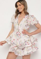 Biała Bawełniana Sukienka w Kwiaty o Rozkloszowanym Kroju z Falbankami Norittia. Białe sukienki damskie Born2be, na co dzień, m, bez wzorów, z bawełny, eleganckie, bez kołnierzyka, bez ramiączek, mini, rozkloszowane. W wyprzedaży za 151.99 zł.
