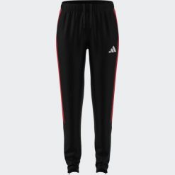 Spodnie piłkarskie damskie ADIDAS Tiro 26. Spodnie materiałowe damskie Adidas, bez wzorów, sportowe. Za 219.99 zł.