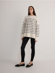 Legginsy z przeszyciami - czarny. Czarne legginsy damskie Reserved, l, bez wzorów, z dzianiny. W wyprzedaży za 39.99 zł.