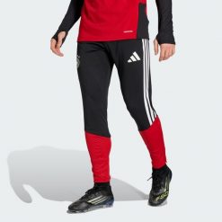 Spodnie Germany 26 Tiro Training. Czarne spodnie materiałowe męskie Adidas, bez wzorów, sportowe. Za 279.00 zł.