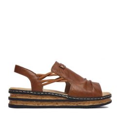 Sandały Rieker. Brązowe sandały damskie Rieker, bez wzorów, bez obcasa, na koturnie. Za 299.99 zł.