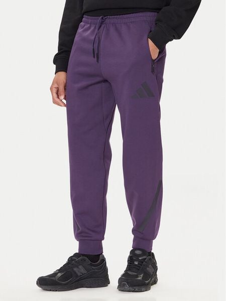Adidas Spodnie dresowe Z.N.E. JW4726 Fioletowy Loose Fit. Fioletowe spodnie dresowe męskie Adidas, bez wzorów, z dresówki. Za 249.99 zł.
