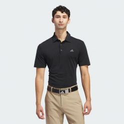 Koszulka polo Ultimate365 Solid. Czarne koszulki polo męskie Adidas, m, bez wzorów, z materiału, bez ramiączek. Za 259.00 zł.