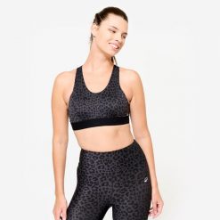 Stanik sportowy Domyos. Czarne biustonosze sportowe damskie DOMYOS, bez wzorów, z elastanu. Za 69.99 zł.