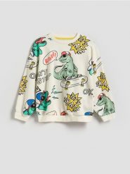 Bluza oversize z nadrukiem - złamana biel. Bluzy i bluzki niemowlęce Reserved, bez wzorów, z bawełny, bez ramiączek, bez kaptura. Za 59.99 zł.