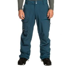 Spodnie snowboardowe męskie Quiksilver Utility. Niebieskie spodnie materiałowe męskie Quiksilver, bez wzorów, sportowe. Za 479.99 zł.