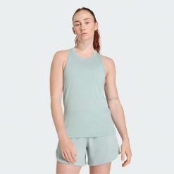 Koszulka treningowa bez rękawów Designed for Training. Zielone bluzki sportowe damskie Adidas, bez wzorów, z materiału, bez ramiączek. Za 149.00 zł.
