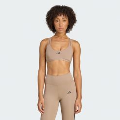 Biustonosz Aeroimpact Luxe Training Light-Support. Niebieskie biustonosze sportowe damskie Adidas, bez wzorów, z materiału. Za 219.00 zł.
