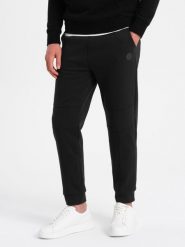 Spodnie męskie dresowe z przeszyciami na nogawkach - czarne V1 OM-PASK-0128 - XXL. Czarne spodnie dresowe męskie Ombre Clothing, bez wzorów, z bawełny. W wyprzedaży za 49.99 zł.