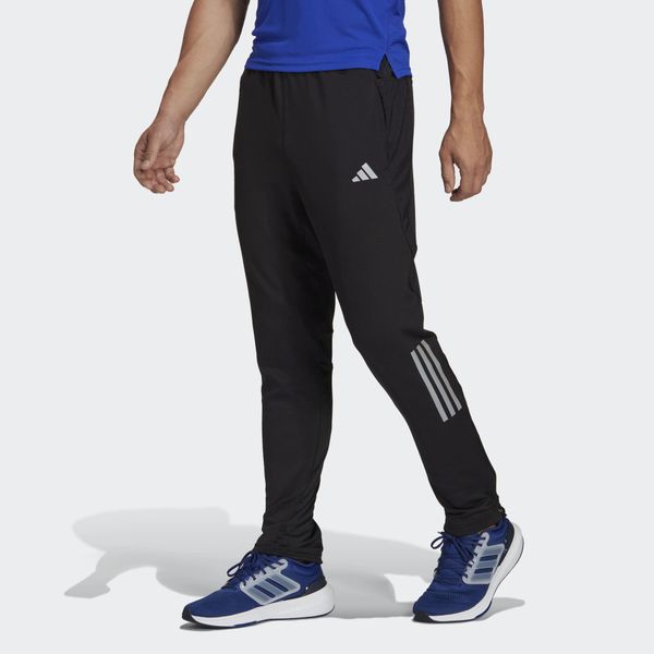 Spodnie Own the Run Astro Knit. Czarne spodnie sportowe męskie Adidas. Za 299.00 zł.