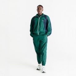 Spodnie dresowe unisex Decathlon AFLF zielone. Zielone spodnie dresowe damskie Decathlon, s, z dresówki, na fitness i siłownię. W wyprzedaży za 99.99 zł.