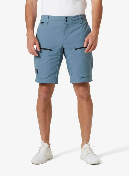 Spodenki męskie Helly Hansen Crewline Cargo Shorts 2.0. Niebieskie szorty męskie Helly Hansen, z materiału, bez kołnierzyka. Za 450.90 zł.