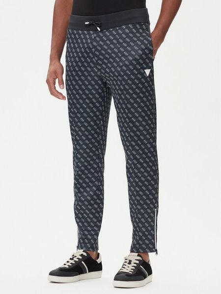 Guess Spodnie dresowe Z2BB05 K7122 Granatowy Regular Fit. Niebieskie spodnie dresowe męskie Guess, z aplikacjami, z bawełny. Za 329.99 zł.
