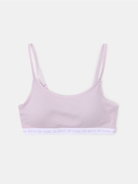 Bawełniany sportowy biustonosz typu top - fioletowy. Fioletowe biustonosze sportowe damskie Sinsay, l, bez wzorów, z bawełny, bez ramiączek. Za 14.99 zł.
