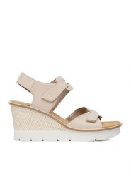 Rieker Sandały 68556-31 Beżowy. Brązowe sandały damskie Rieker, bez wzorów, ze skóry, bez obcasa, na koturnie. Za 349.99 zł.