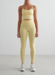 Damskie legginsy bezszwowe, wysoki stan, squat proof petite Shape żółty mellow. Żółte legginsy damskie Aim'n, m, bez wzorów, z elastanu. Za 296.00 zł.