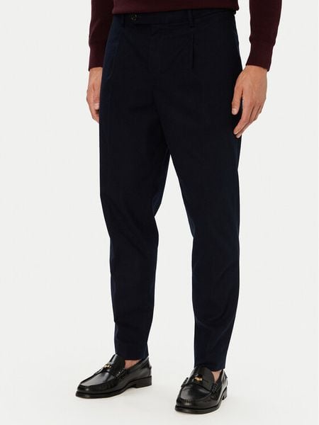 Tommy Hilfiger Spodnie materiałowe MW0MW45058 Granatowy Tapered Fit. Niebieskie spodnie materiałowe męskie Tommy Hilfiger, bez wzorów, z bawełny. Za 569.99 zł.