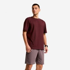 Koszulka sportowa męska Domyos. Fioletowe t-shirty sportowe męskie DOMYOS, l, z bawełny, bez ramiączek, na fitness i siłownię. Za 44.99 zł.