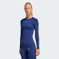 Koszulka TECHFIT Long Sleeve Training. Niebieskie bluzki sportowe damskie Adidas, z materiału, bez kołnierzyka, bez ramiączek. Za 199.00 zł.