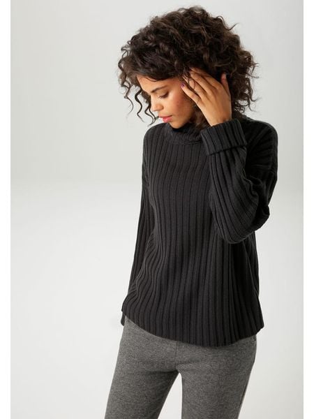 Aniston Golf w kolorze czarnym rozmiar: 38. Czarne golfy damskie Aniston, bez wzorów, ze splotem, bez ramiączek. Za 78.47 zł.