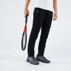 Spodnie do tenisa męskie Artengo Soft. Czarne spodnie materiałowe męskie ARTENGO, bez wzorów, z bawełny, sportowe. Za 119.99 zł.