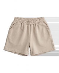 Damskie szorty dresowe UNLEASH WINGS BEIGE. Brązowe szorty damskie Wings, bez wzorów, z bawełny, wakacyjne. Za 169.90 zł.