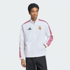 Bluza reprezentacyjna z podstawowego kompletu Real Madryt. Białe bluzy bez kaptura męskie Adidas, l, z dresówki. Za 529.00 zł.