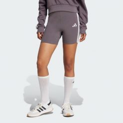Szorty Essentials 3-Stripes High Waisted Biker. Białe spodenki sportowe damskie Adidas, bez wzorów, z bawełny, sportowe. W wyprzedaży za 71.40 zł.