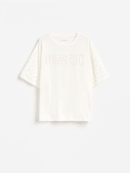Bawełniany t-shirt z aplikacjami - złamana biel. Koszulki dziewczęce Reserved, z aplikacjami, z bawełny, bez ramiączek. Za 39.99 zł.