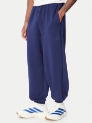 Adidas Spodnie dresowe Soft Lux KS2775 Niebieski Loose Fit. Niebieskie spodnie dresowe męskie Adidas, bez wzorów, z dresówki. Za 329.99 zł.