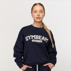 Bluza damska fitness bez kaptura niebieska Varsity. Niebieskie bluzy sportowe damskie GYMBEAM, s, z bawełny. Za 139.90 zł.