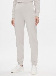 Calvin Klein Spodnie dresowe Metallic Micro Logo Jogger K20K206965 Beżowy Regular Fit. Brązowe spodnie dresowe damskie CALVIN KLEIN, xxl, bez wzorów, z dresówki. Za 519.99 zł.
