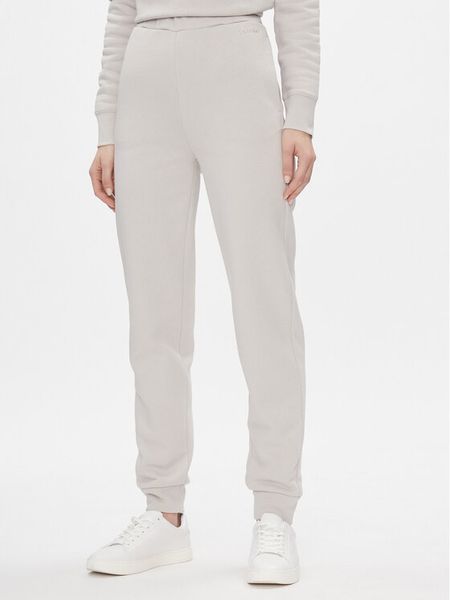Calvin Klein Spodnie dresowe Metallic Micro Logo Jogger K20K206965 Beżowy Regular Fit. Brązowe spodnie dresowe damskie CALVIN KLEIN, s, bez wzorów, z dresówki. Za 279.99 zł.
