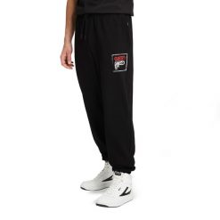 Spodnie męskie FILA Luton Track. Czarne spodnie materiałowe męskie Fila, bez wzorów, z bawełny, sportowe. Za 129.99 zł.