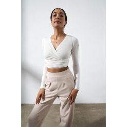 Top do jogi Moonholi Total Eclipse z długim rękawem. Białe topy damskie MOONHOLI, l, bez wzorów, bez kołnierzyka. Za 329.00 zł.