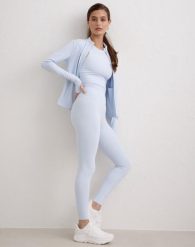 Damskie legginsy z wysokim stanem, squat proof, dla niskich Sense niebieskie. Niebieskie legginsy damskie Aim'n, s, bez wzorów, z elastanu. Za 297.00 zł.