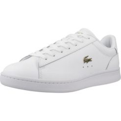 Tenisówki Lacoste Model Carnaby Kolor Biały. Białe trampki i tenisówki damskie Lacoste, bez wzorów, ze skóry. Za 389.99 zł.