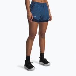 Spodenki do biegania damskie Under Armour Fly By 2IN1. Niebieskie szorty damskie Under Armour, bez wzorów, sportowe. Za 169.99 zł.