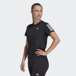 Koszulka do biegania damska Adidas Own the Run Tee. Czarne bluzki damskie Adidas, xs, bez wzorów, z materiału, sportowe, bez kołnierzyka, bez ramiączek. Za 130.99 zł.