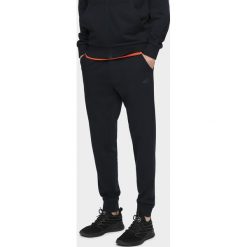 Spodnie dresowe męskie SPMD300 - granat. Spodnie dresowe męskie 4f, bez wzorów, z dresówki. Za 119.99 zł.