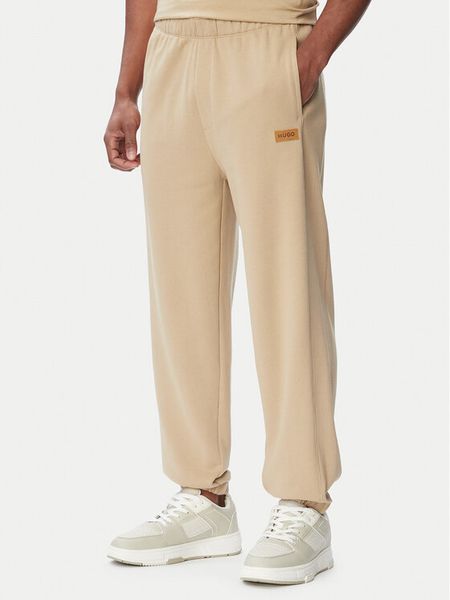 HUGO Spodnie dresowe Nevatro 50564047 Beżowy Regular Fit. Brązowe spodnie dresowe męskie Hugo, bez wzorów, z bawełny. Za 499.99 zł.