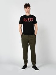 Guess Spodnie "Takoda" | X3OQ21K8XF0 | Mężczyzna | Khaki. Brązowe spodnie materiałowe męskie Guess, z aplikacjami, z elastanu, eleganckie. W wyprzedaży za 259.00 zł.
