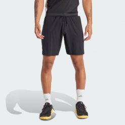 Szorty Tennis Ergo. Czarne szorty męskie Adidas, bez wzorów, z materiału, sportowe. Za 249.00 zł.