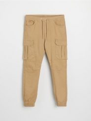 Jeansy regular jogger cargo - żółty. Żółte jeansy męskie Sinsay. Za 99.99 zł.