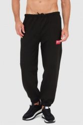 KENZO Czarne spodnie dresowe męskie. Czarne spodnie dresowe męskie Kenzo, bez wzorów, z dresówki. W wyprzedaży za 569.99 zł.