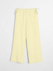 Muślinowe spodnie wide leg - żółty. Żółte spodnie materiałowe damskie Sinsay, bez wzorów. Za 49.99 zł.