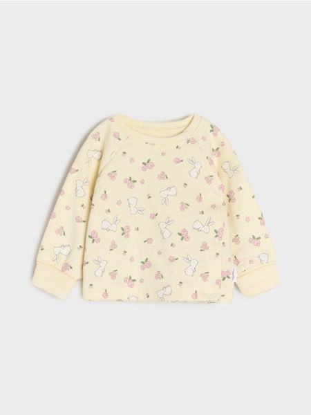 Ocieplana bluza z podwijanymi mankietami - kremowy. Białe bluzy i bluzki niemowlęce Sinsay, bez wzorów, bez ramiączek, bez kaptura. Za 15.99 zł.